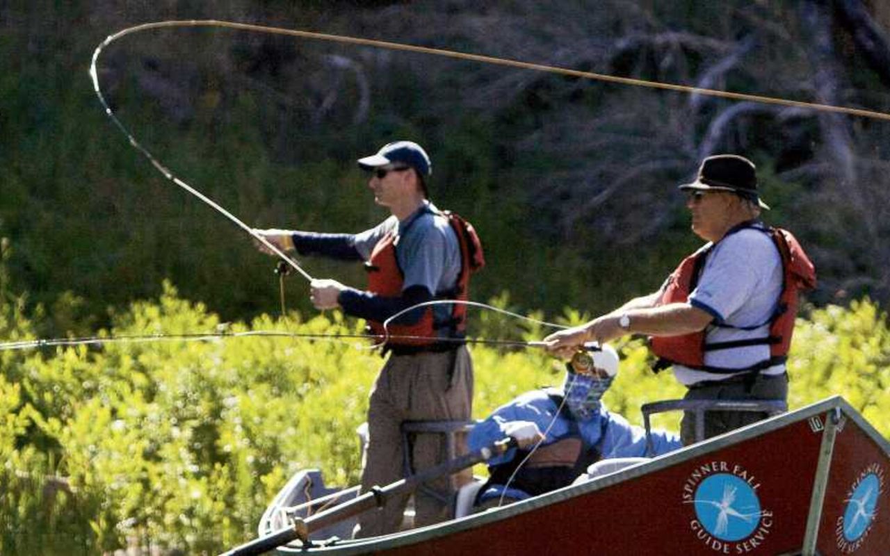 Flaming Gorge Guides & Rentals | Photo Gallery | 1 - Men fly fishing from a boat in the Green River